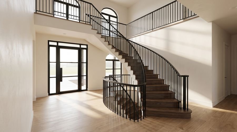 Curved staircase in a double-height entry hall